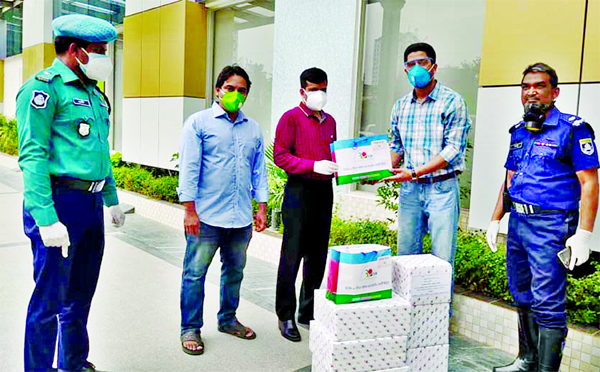 Secretary General of Trimatrik-30 BCS Officers' Co-operative Society Limited Dr. Latiful Bari handed over Personal Protection Equipments to the Superintendent of Central Police Hospital in the city on Tuesday to tackle coronavirus.