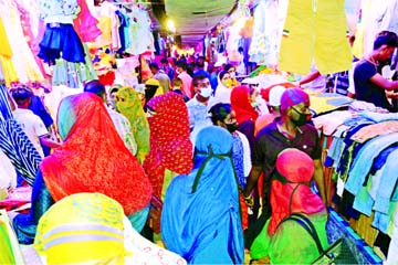 Eid shoppers throng to Rajdhani Market in Dhaka on Wednesday ignoring physical distancing protocol.