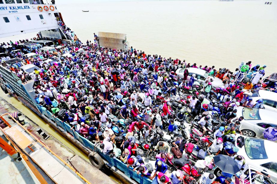 Thousands of people crowd at a ferry for crossing River Padma through Kathalbari- Shimulia route in their desperate bid to return Dhaka after celebrating Eid-ul-Fitr defying the social distancing and the risk of coronavirus infection. This photo was taken