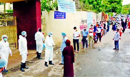 Suspected corona patients rush at the fever clinic of Bangabandhu Sheikh Mujib Medical University (BSMMU) in Dhaka on Saturday amid spike in the positive Covid-19 cases in the country.