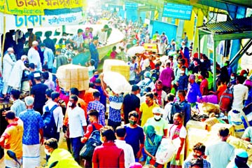 Thousands of passengers throng Sadarghat Launch Terminal on Monday with total disregard to physical distancing norms.