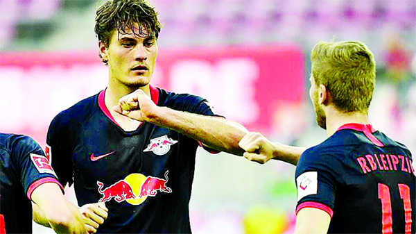 Leipzig's forward Patrik Schick (left) celebrates with teammates Leipzig's forward Timo Werner at Cologne on Monday.