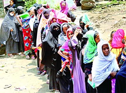 Social distancing is not getting any importance even to the women who were waiting in a line at Amin Bazar area of Savar upazila to receive old-age allowance on Wednesday.