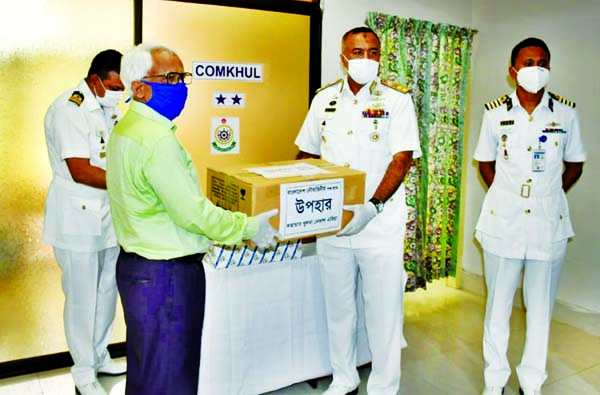 Members of Bangladesh Navy distributing Personal Protective Equipment to the doctors and nurses at Barguna Sadar Hospital recently to fight coronavirus. ISPR photo