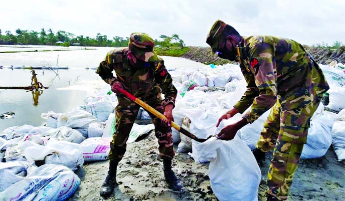 Bangladesh Army engaged in constructing embankments in the cyclone Amphan-hit area in Satkhira on Saturday.