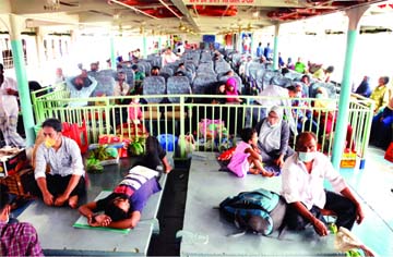 A launch leaves the city's Sadarghat terminal for Barishal with thin passengersâ€™ occupancy amid massive spike in coronavirus cases across the country.