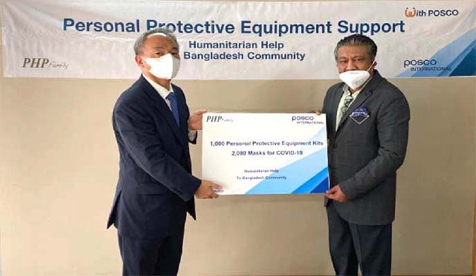Jung Boom Lee, Country Manager, POSCO International Corporation's Bangladesh Liaison Office, handing over the protection equipment to Mohammad Mohsin, Honorary Consul of South Korea and Vice Chairman of the PHP Family, on Monday.