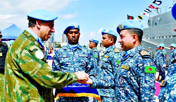 United Nations Interim Force in the Lebanon (UNIFL) Maritime Task Force (MTF) Commander Rear Admiral Sergio Renato Berna Salgueirinho handing over the UN Peace Medals among 110 Bangladesh Navy personnel working as peacekeepers under UNIFL at a ceremony he