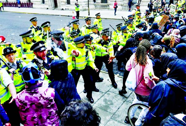 Police clash with demonstrators in Whitehall during a Black Lives Matter protest in London, following the death of George Floyd who died in police custody in Minneapolis, London on Monday.