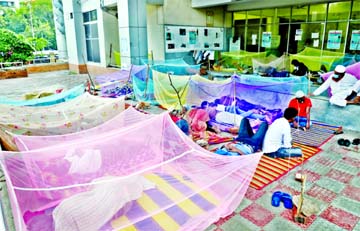 Attendants of child patients have to pass night-time outside the hospital as they do not get permission to stay inside the Dhaka Shishu Hospital for the sake of social distancing to check corona transmission.