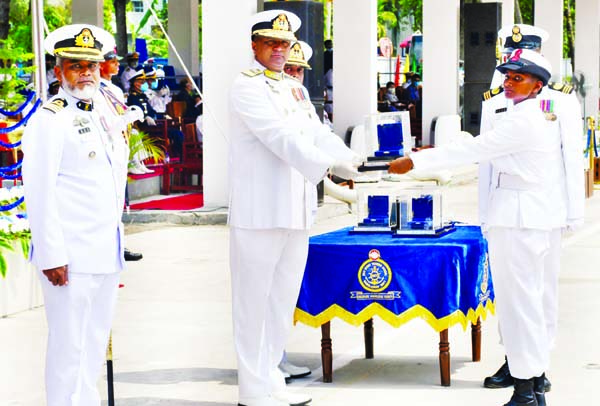 Khulna Naval Area Commander Rear Admiral Mohammad Musa presents 'Priteelata Waddedar Medal' to Meera Akhter, a female sailor of Bangladesh Navy of A 2020 batch for her outstanding role at BNS Titumir Parade Ground in Khulna on Tuesday. ISPR photo