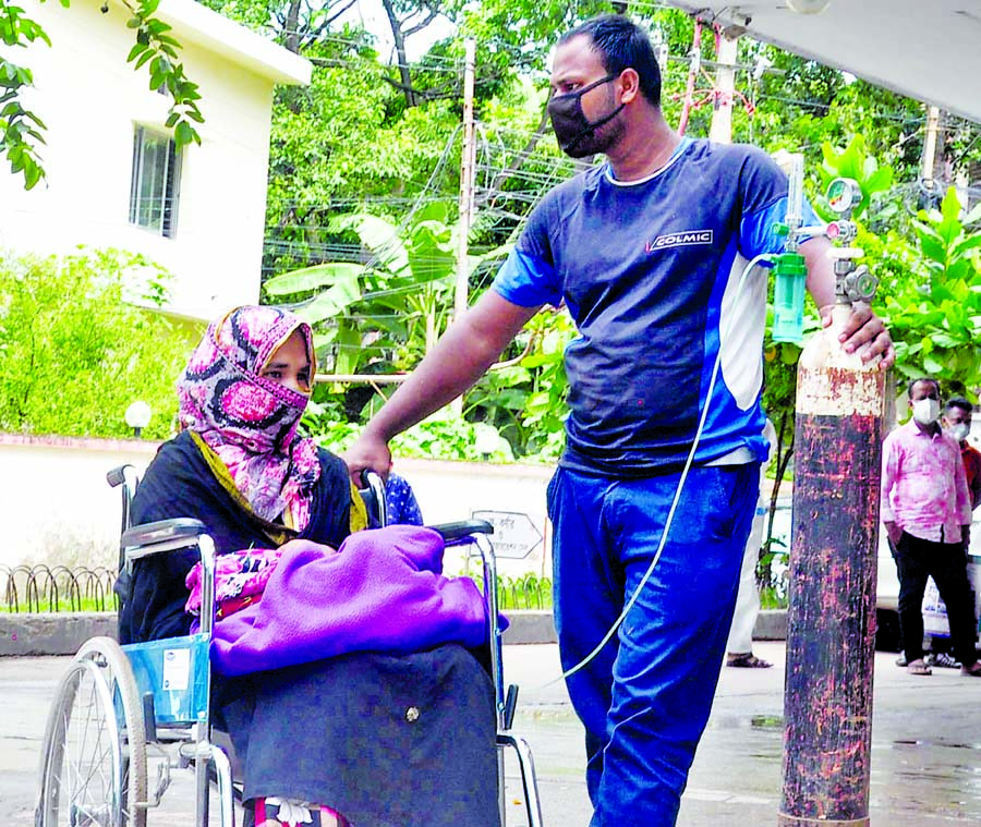 A woman stairing with blank eyes and a child in her lap helplessly waiting for admission to Chattogram Medical College and Hospital after several other healthcare facilities at the Port city refused to admit the child.