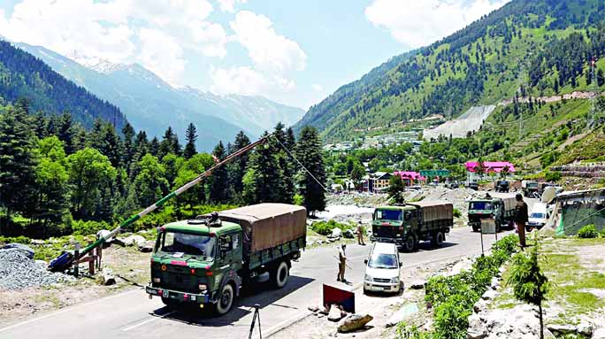 Indian army trucks move along a highway leading to Ladakh, at Gagangeer in Kashmir's Ganderbal district on Wednesday.