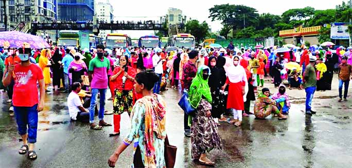 Workers of Santa Garments block Dhaka-Tongi Highway at Azampur, Uttara in the capital on Wednesday, demanding continued operation of their factory and payment of due salaries.