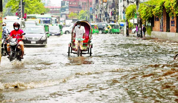 Many streets in Dhaka submerged following torrential rains on Thursday adding to the misery of the city dwellers. Even the road adjoining to Dhanmondi-27 went under water after the incessant rain due to the city's poor drainage system. This photo, t