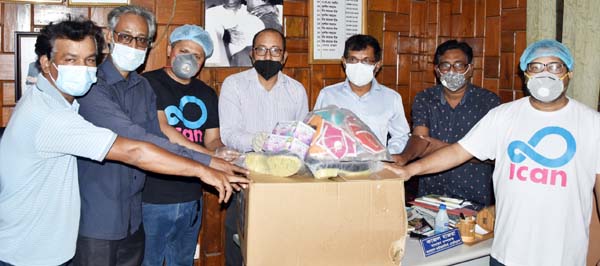 President of I Can Trust Kawser Mahmud handing over Personal Protective Equipment (PPE) to President of Bangladesh Photo Journalists Association (BPJA) Golam Mostofa at the office of BPJA in the city on Saturday.