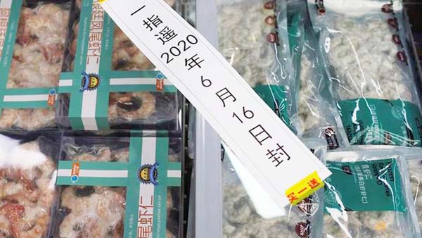 Frozen seafood products made of imported shrimps are seen inside a sealed freezer at a supermarket following a new outbreak of Covid-19 in Beijing on Saturday.