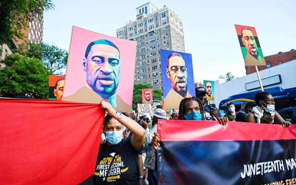 People take part in events to mark Juneteenth, which commemorates the end of slavery in Texas, two years after the 1863 Emancipation Proclamation freed slaves elsewhere in the United States, amid nationwide protests against racial inequality in the Brookl