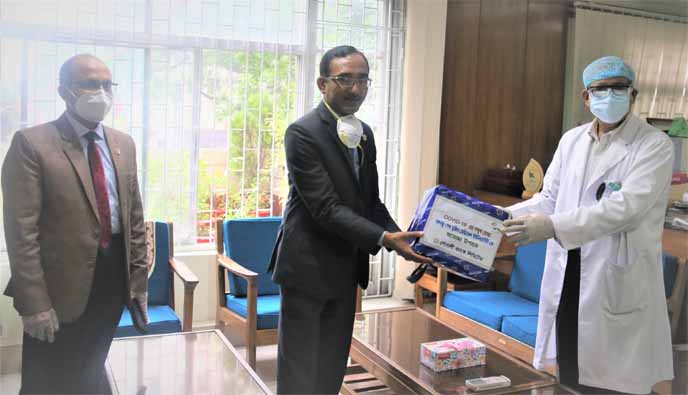 Md. Zahidul Haque, Deputy Managing Director of Sonali Bank Ltd, handing over medical protective equipments to Professor Dr Kanak Kanti Barua, Vice-Chancellor Bangabandhu Sheikh Mujib Medical University (BSMMU) at the chancellor's office in the city on Su