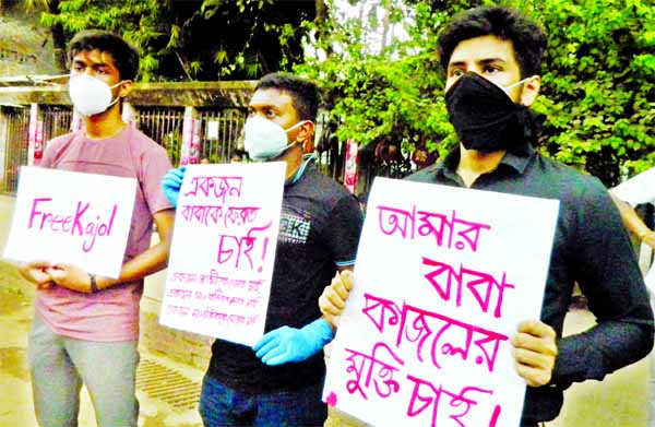 Relatives and children of journalist Kajol formed a human chain in front of the Jatiya Press Club on Monday demanding release of Kajol.