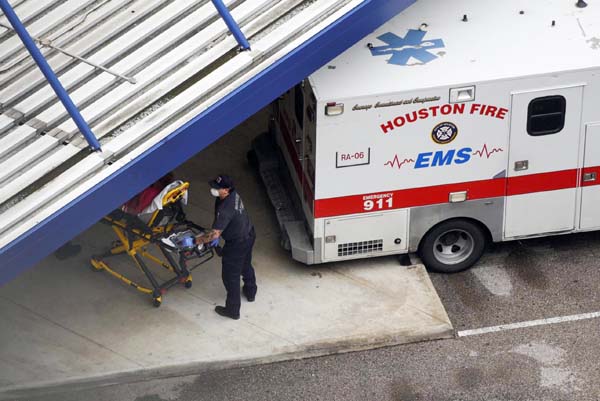 A patient is wheeled into Houston Methodist Hospital as storm clouds gather over the Texas Medical Center, amid the global outbreak of the coronavirus, in Houston, Texas. Internet