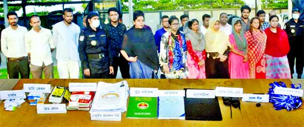 RAB officials arrested 20 fraudsters who lured people with jobs in a raid in Dhaka's Mohakhali area on Tuesday.