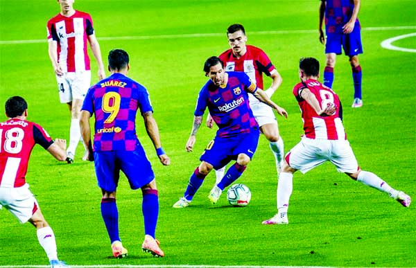 Barcelona's Lionel Messi (3rd right) controls the ball during a Spanish league football match between Barcelona and Athletic Bilbao in Barcelona, Spain on Tuesday.