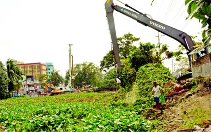 Dhaka WASA launches cleanliness drive of DND Canal in the capital on Wednesday. This photo was taken from Konapara.