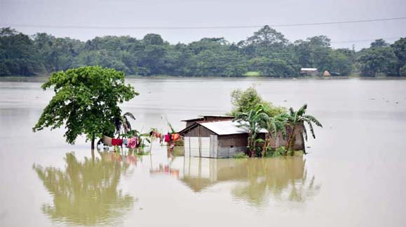 A partially submerged house is seen at the flood-affected Mayong village in Morigaon district, in the northeastern state of Assam.
