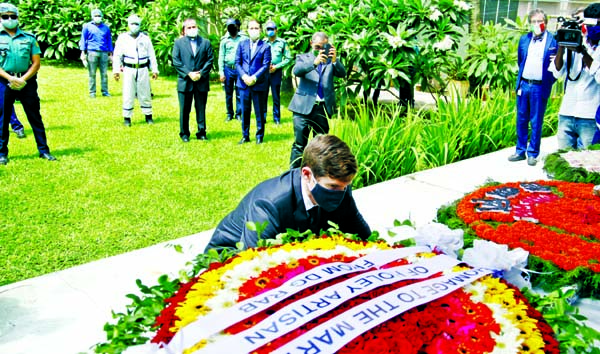US Ambassador to Bangladesh Earl R. Miller along with other diplomats and law-enforcers pay tributes to those who were killed in militant attack at the Holey Artisan Bakery by placing floral wreaths on its premises in the city on Wednesday marking the 4th