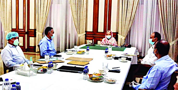 Prime Minister Sheikh Hasina presides over the meeting about the closure of state-run jute mills at Ganobhaban on Thursday.