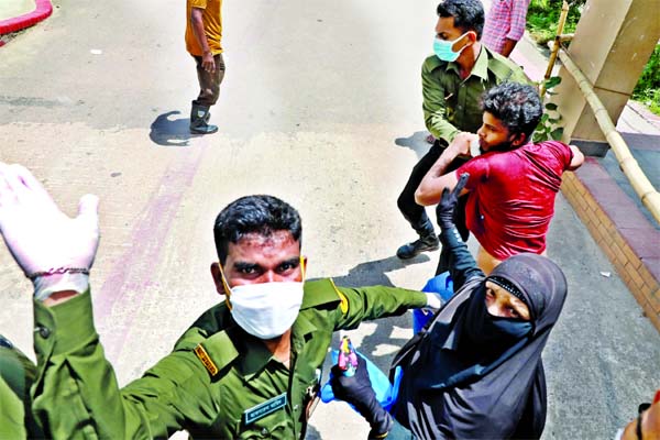 Photo shows a glimpse of clash between suspected Covid-19 patients and the Ansar members at Mugda General Hospital in Dhaka on Friday.