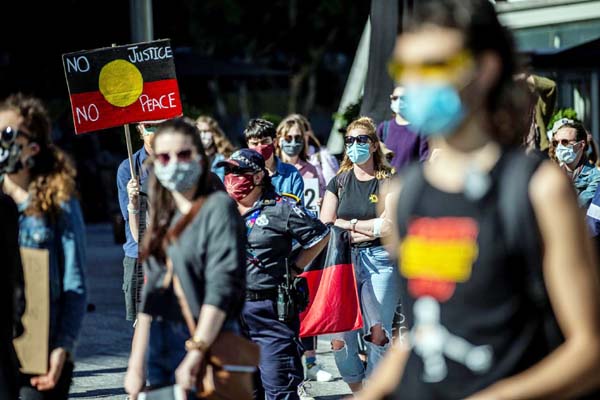 Protesters participate in a Black Lives Matter (BLM) rally, calling for an end to police brutality against Black people in the United States and First Nations people in Australia, in Brisbane on Saturday. Internet