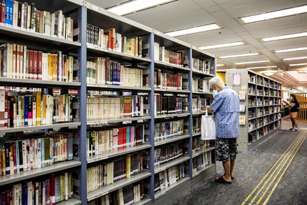 A man looks at books in a public library in Hong Kong on Saturday. Internet