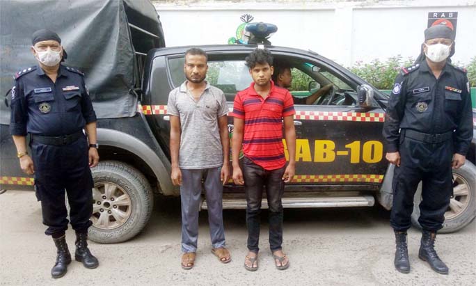 RAB-10 nabbed two drug peddlers along with huge quantity of yaba tablets conducting raid in the city's Jatrabari area on Monday.