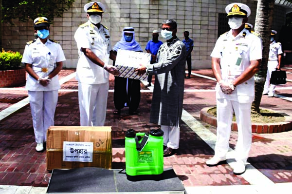 Zonal Commander of Khulna Navy Rear Admiral Mohammad Musa hands over Personal Protective Equipment to the authority of Bangabandhu Sheikh Mujibur Rahman Monument in Tungipara on Tuesday ISPR photo