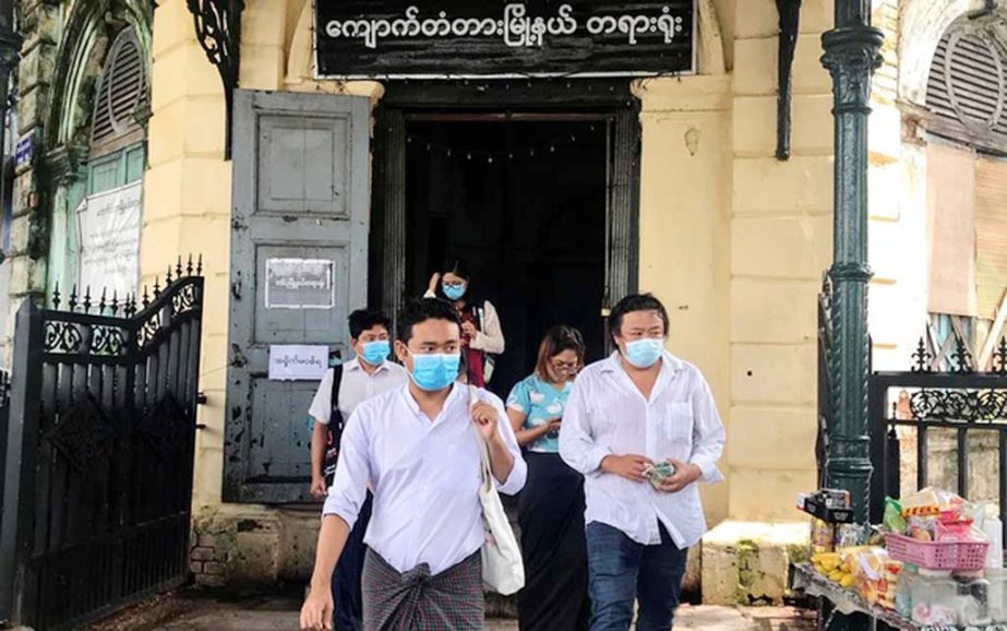 Youth activist Maung Saung Kha, (C), leaves at a court in Yangon, Myanmar on Tuesday. Internet
