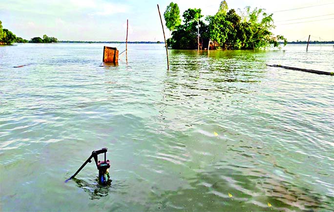 Everything goes under water even the tube-well, the only source of pure drinking water, as floodwater submerged entire Nangla Union of Melandah in Jamalpur district. The photo was taken from Nailer Ghat Bazar on Wednesday.