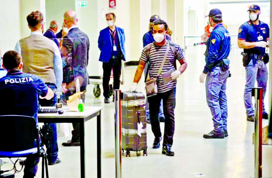 A Bangladesh expatriate passes through the check-point at the Rome's Fiumicino Airport on Wednesday.