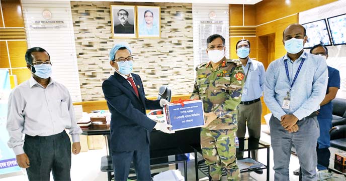 On behalf of Md Ataur Rahman Prodhan, CEO of Sonali Bank Limited, Mir Hasan Mohammad Zahid, Deputy General Manager (In-charge) of Rajshahi General Manager's office of the bank, handing over 200 set PPE for doctor & nurses uses to Brigadier General Md. Za