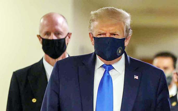 US President Donald Trump wears a mask while visiting Walter Reed National Military Medical Centre in Bethesda, Maryland on Saturday.