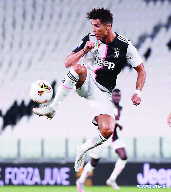 Juventus' Cristiano Ronaldo jumps to stop the ball during the Serie A football match between Juventus and Atalanta in Turin, Italy on Saturday.