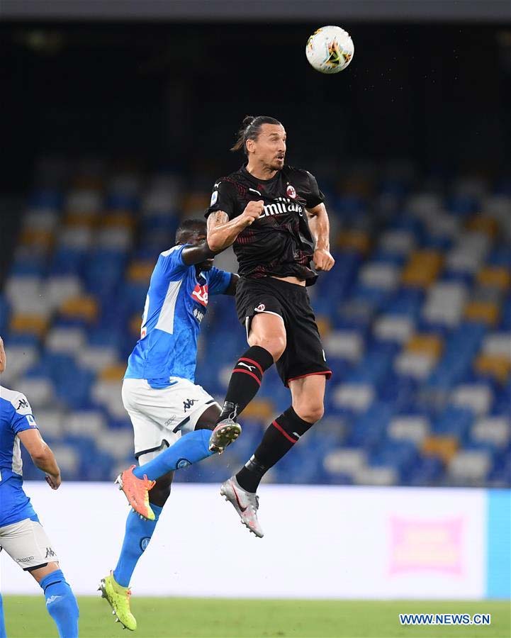 AC Milan's Zlatan Ibrahimovic (right) vies with Napoli's Kalidou Koulibaly during a Serie A football match between Napoli and AC Milan in Naples, Italy on Sunday.