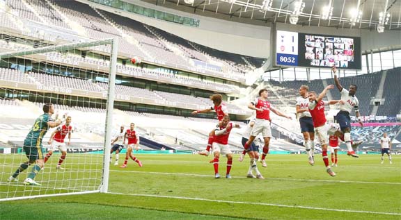 Tottenham Hotspur's Toby Alderweireld (right) scores their second goal against Arsenal in London, Britain on Sunday.