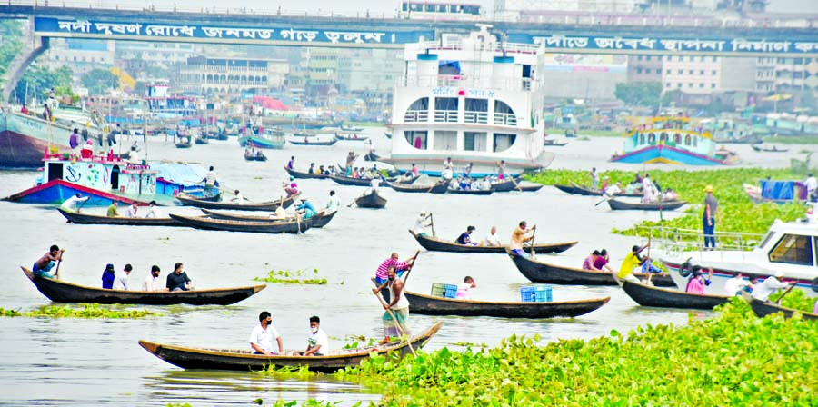 Hundreds of commuters continue to cross the Buriganga River boarding small wooden boats taking risk of lives although 33 people died very recently when a small launch sank in the river after a larger one crashed into it near Sadarghat Terminal in the capi