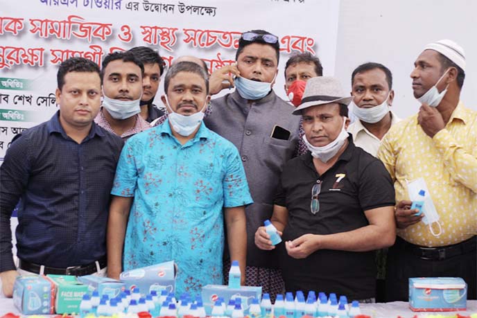 Md. Yusuf Ali, Managing Director along with other directors of IBDL Group, a concern of Italy Bangladesh Developments Limited, poses for photograph at a hand over ceremony of health care materials for distribution to Sheikh Selim, 37 no Ward Councilor of