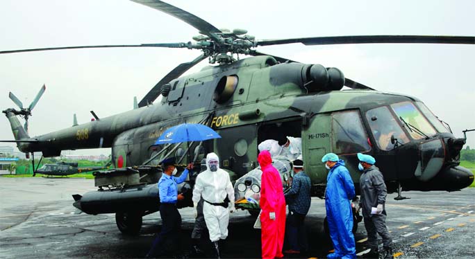 Coronavirus infected VC of Patuakhali Science and Technology University Prof Dr. Harun-ar-Rashid and his wife Konika Mahfuz being shifted to Dhaka by a helicopter of Bangladesh Air Force on Tuesday for better treatment.