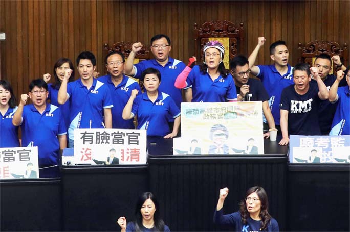 Lawmakers from the main opposition Kuomintang (KMT) party occupy the parliament to protest against the nomination of a close aide to the President to a top-level watchdog in Taipei, Taiwan on Tuesday.