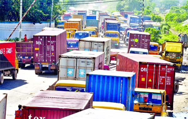 A huge gridlock at Saltgola crossing in Chattogram city on Thursday when dozens of container carriers come out from Chattogram Port after loading imported goods to deliver at different parts of the country.