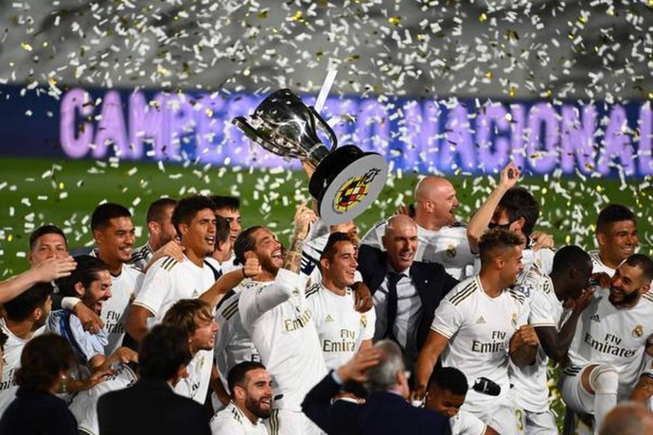 Real Madrid's players celebrate winning the La Liga title after the Spanish League football match between Real Madrid CF and Villarreal CF at the Alfredo di Stefano stadium in Valdebebas, on the outskirts of Madrid on Thursday.